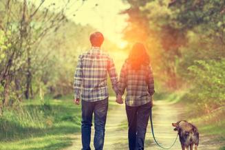 Photo of Couple walking dog, holding hands, Catherine M. Bowers, PLC Law Office